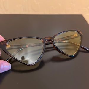 Cat-eye glasses with yellow tint